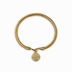 Pulsera de oro adornada con monedas